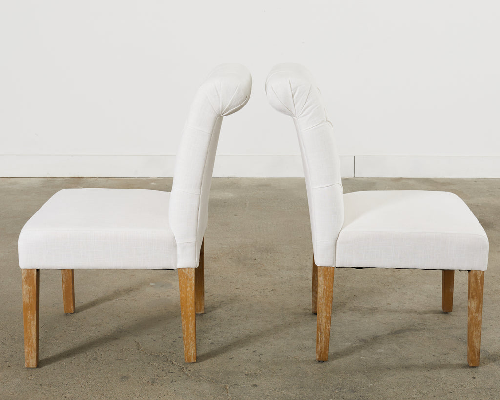 Set of Fourteen Tufted Scroll Back Dining Chairs