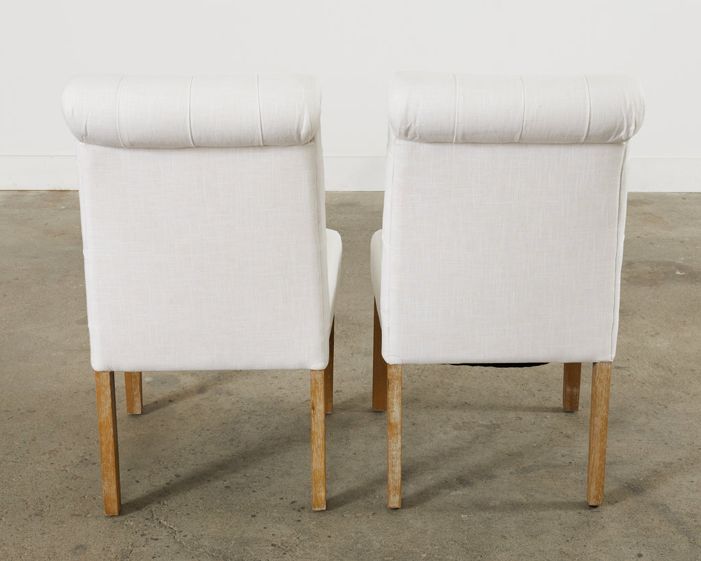 Set of Fourteen Tufted Scroll Back Dining Chairs