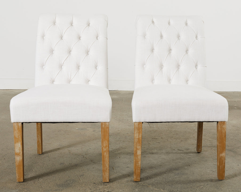 Set of Fourteen Tufted Scroll Back Dining Chairs