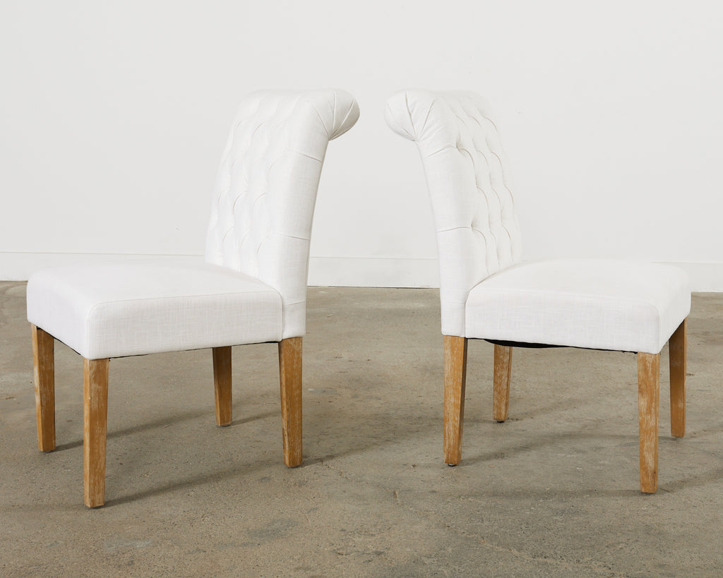 Set of Fourteen Tufted Scroll Back Dining Chairs