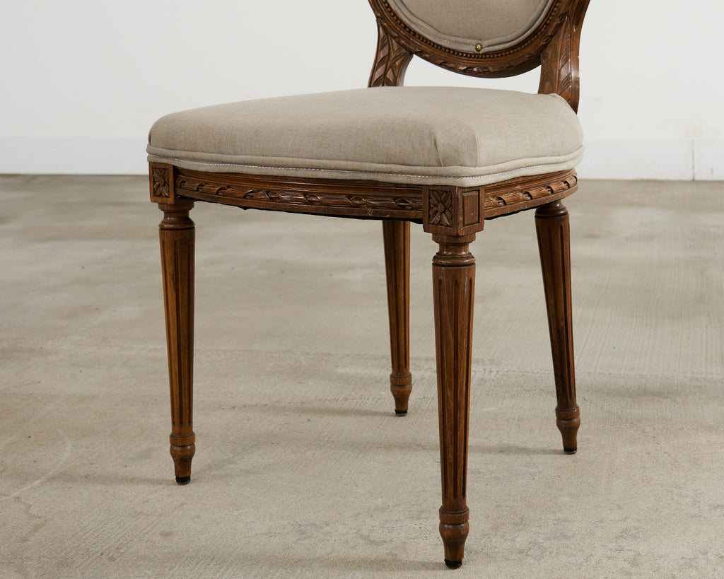 Set of Four French Louis XVI Style Walnut Dining Chairs