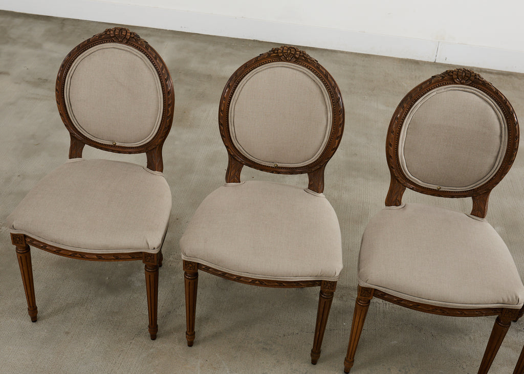Set of Four French Louis XVI Style Walnut Dining Chairs