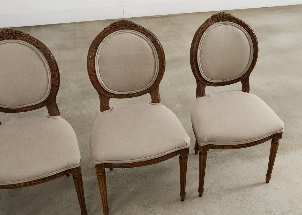 Set of Four French Louis XVI Style Walnut Dining Chairs