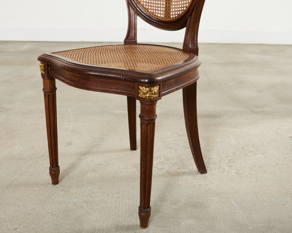 Set of Eight Louis XVI Style Bronze Ormolu Caned Dining Chairs