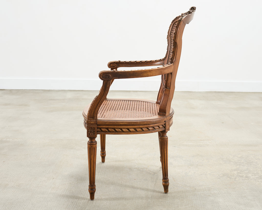 French Louis XVI Style Carved Walnut Cane Fauteuil Armchair