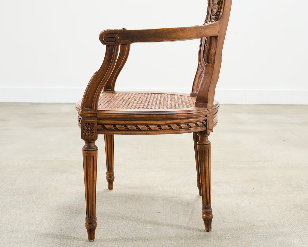 French Louis XVI Style Carved Walnut Cane Fauteuil Armchair