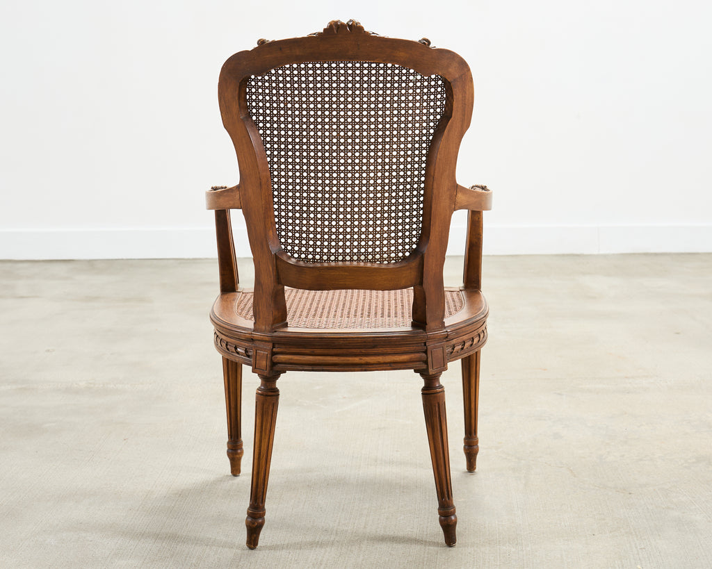 French Louis XVI Style Carved Walnut Cane Fauteuil Armchair