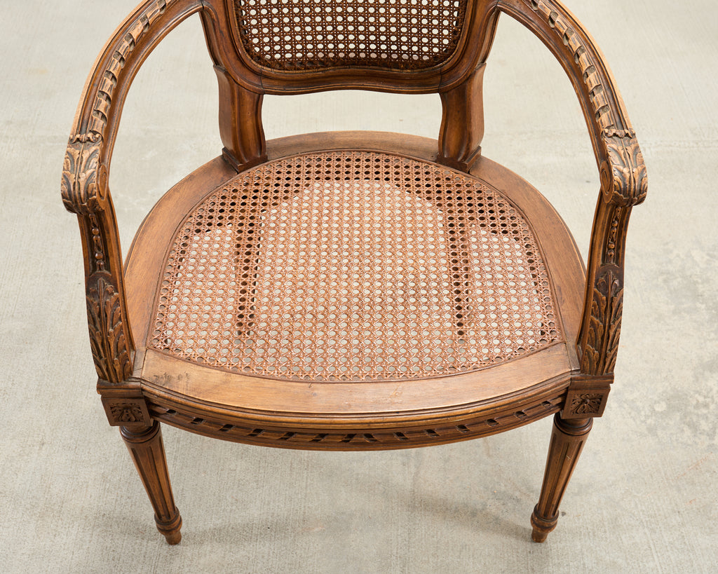 French Louis XVI Style Carved Walnut Cane Fauteuil Armchair