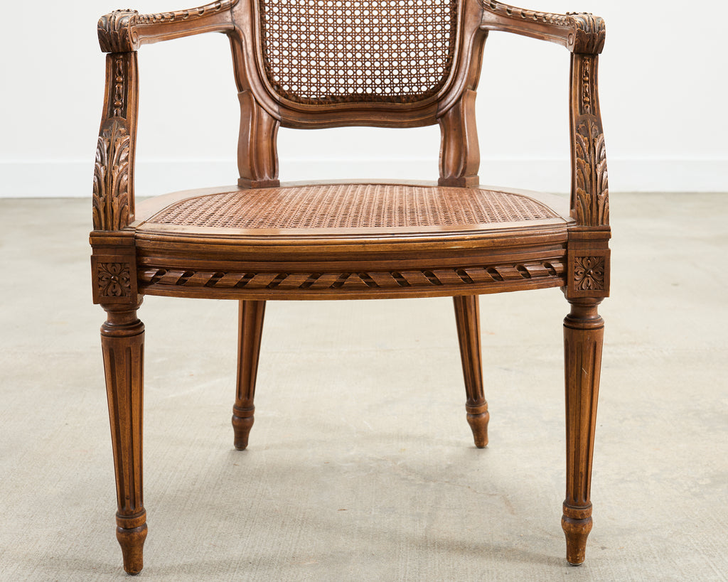 French Louis XVI Style Carved Walnut Cane Fauteuil Armchair