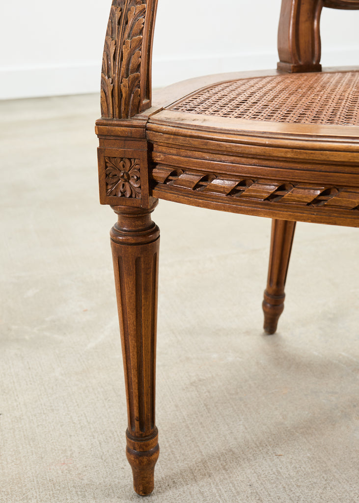 French Louis XVI Style Carved Walnut Cane Fauteuil Armchair