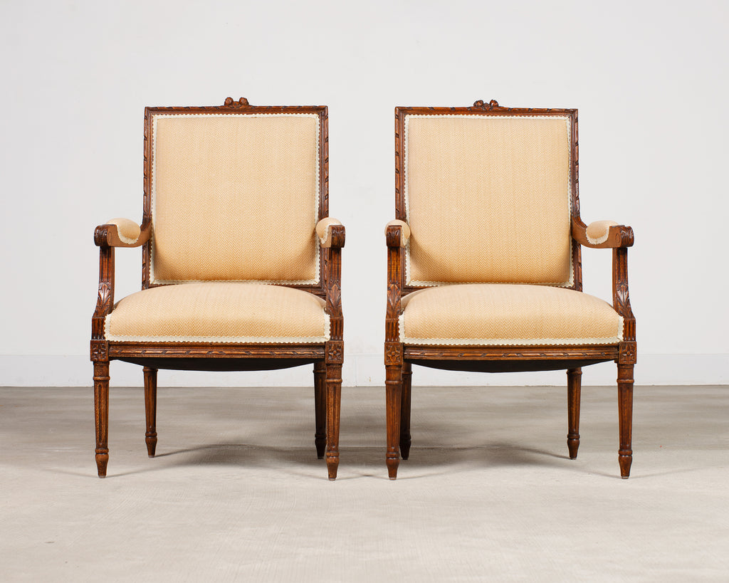 Pair of French Louis XVI Carved Walnut Fauteuil Armchairs