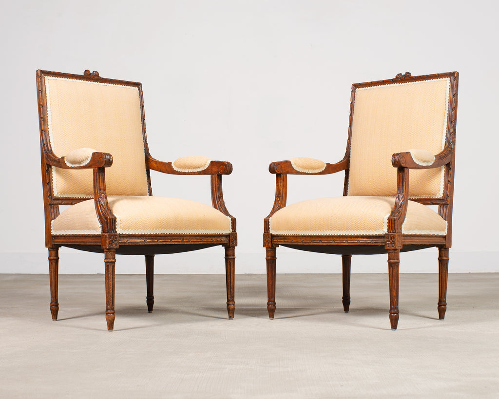Pair of French Louis XVI Carved Walnut Fauteuil Armchairs