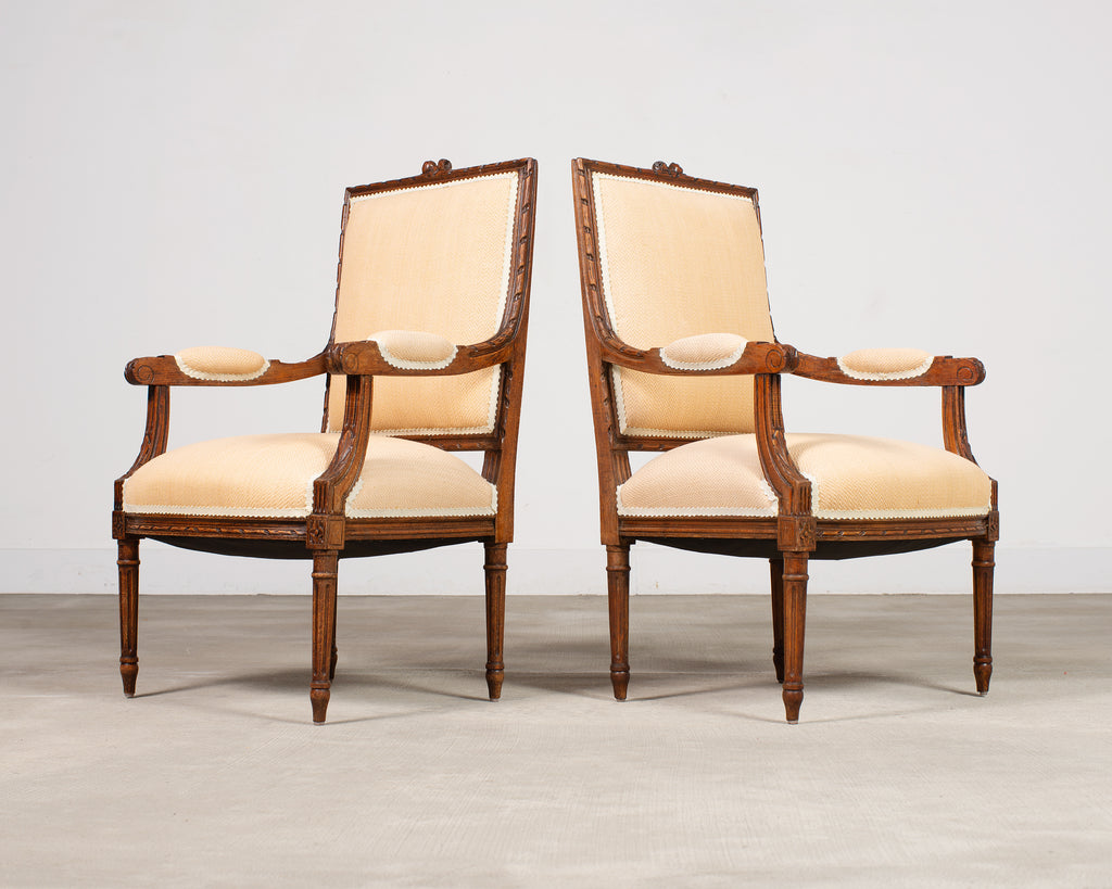 Pair of French Louis XVI Carved Walnut Fauteuil Armchairs