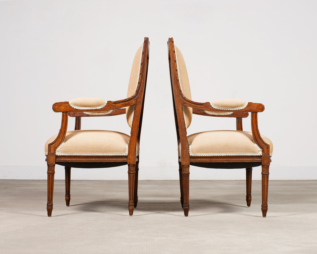Pair of French Louis XVI Carved Walnut Fauteuil Armchairs
