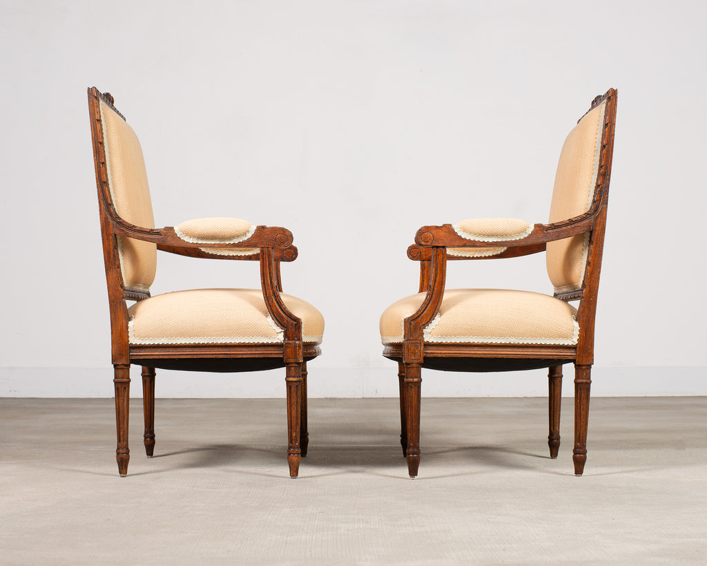 Pair of French Louis XVI Carved Walnut Fauteuil Armchairs