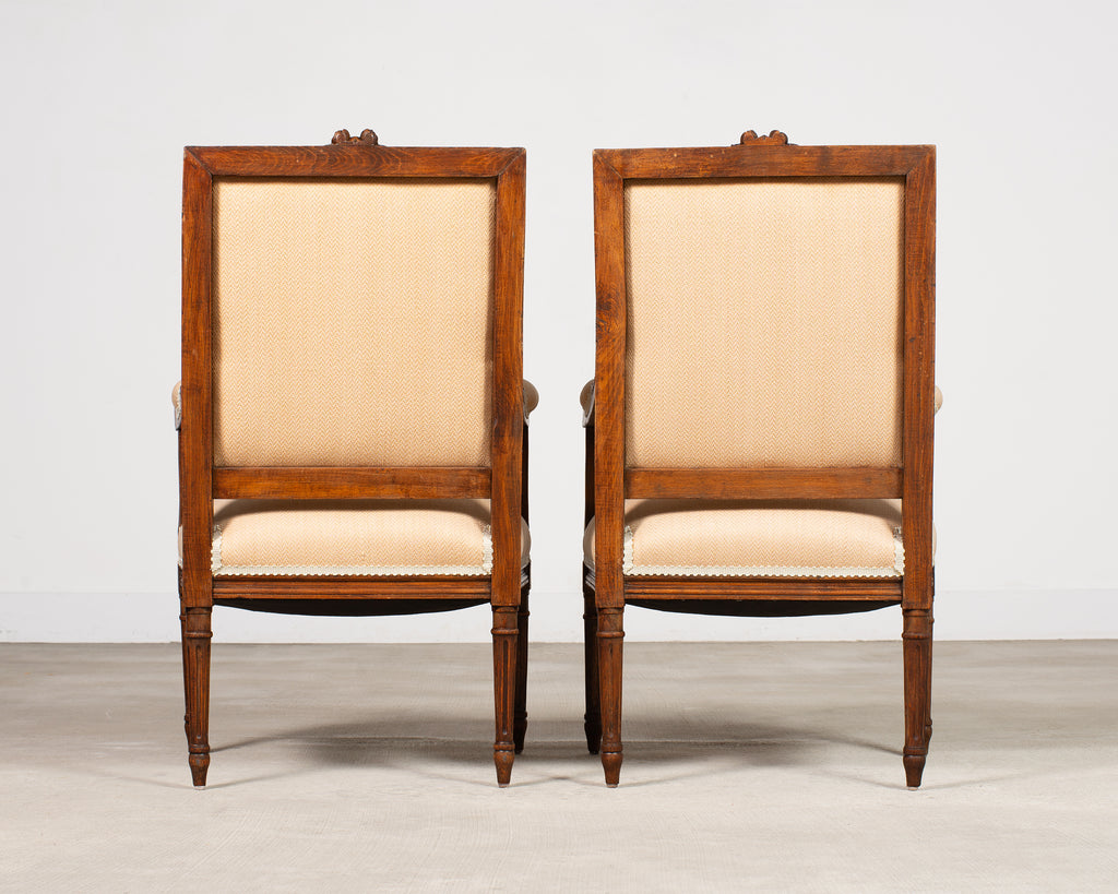 Pair of French Louis XVI Carved Walnut Fauteuil Armchairs
