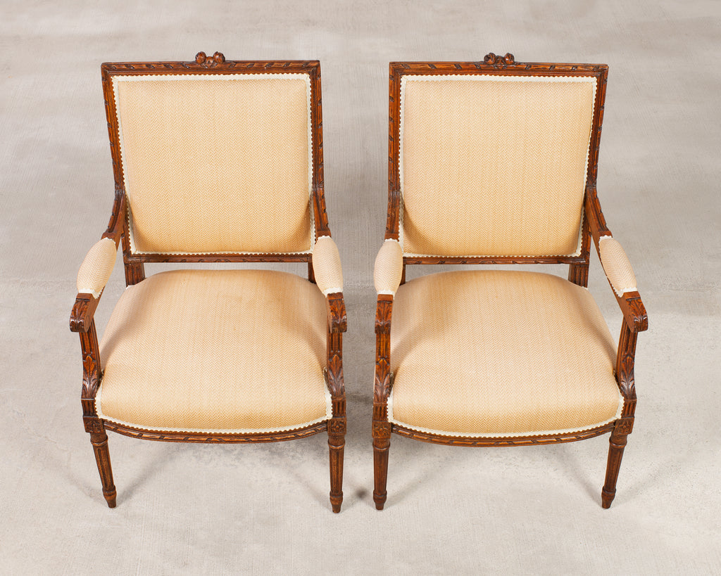 Pair of French Louis XVI Carved Walnut Fauteuil Armchairs