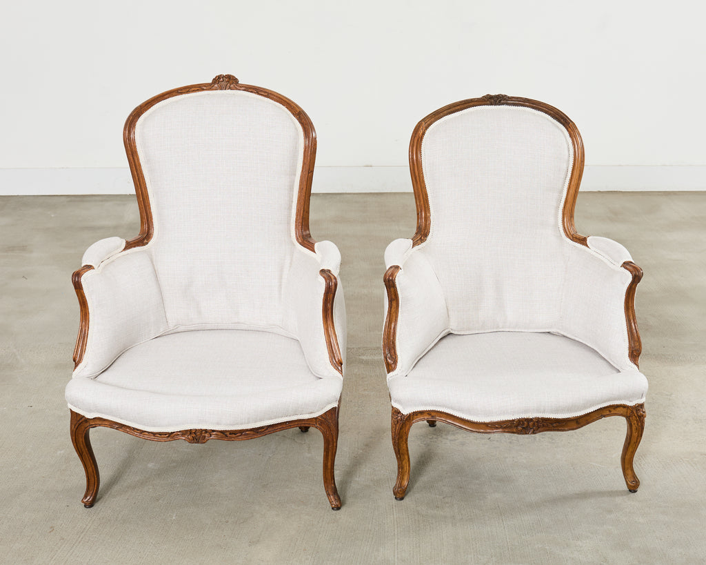 Pair of French Louis XV Style Walnut Bergeres with Linen