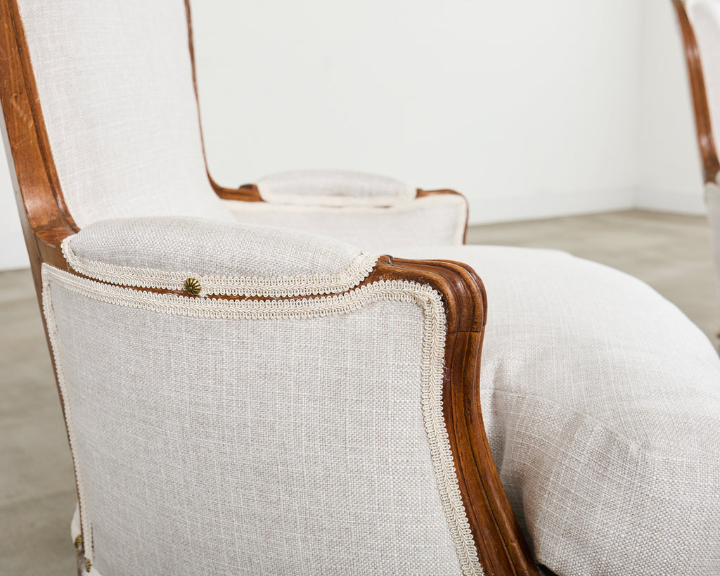 Pair of French Louis XV Style Walnut Bergeres with Linen