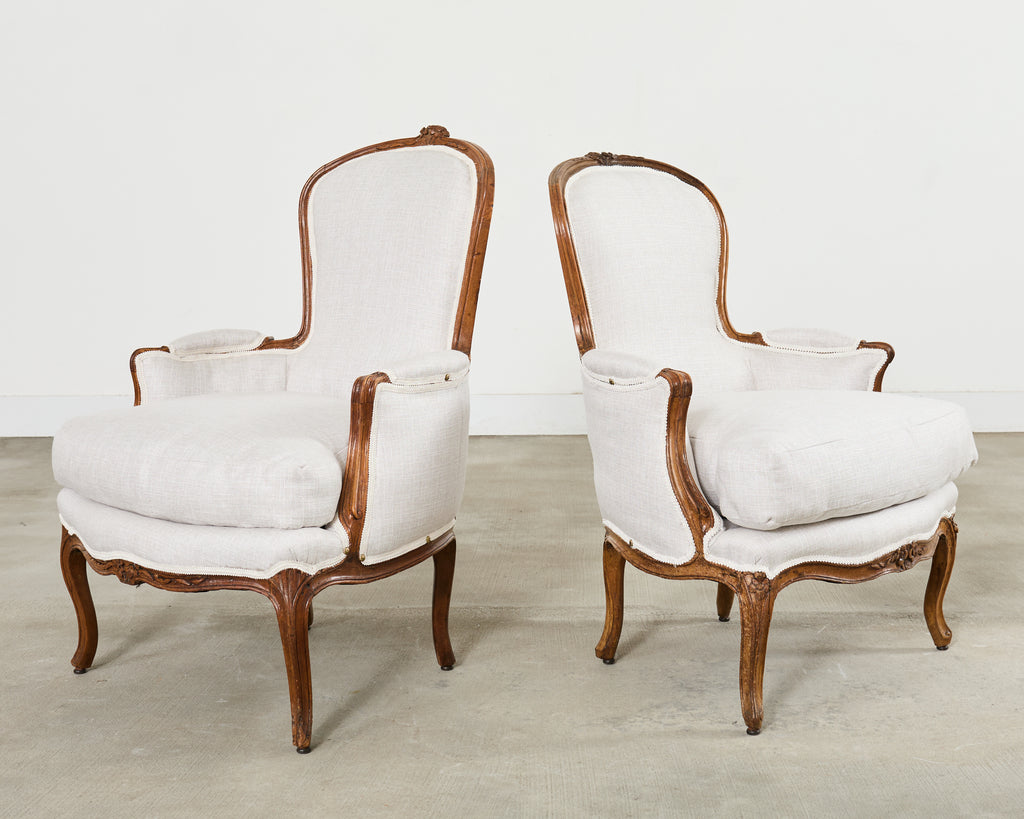 Pair of French Louis XV Style Walnut Bergeres with Linen