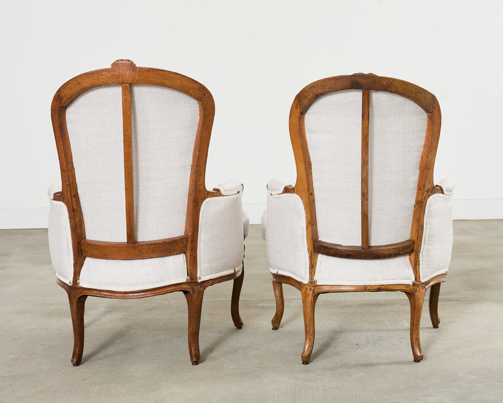 Pair of French Louis XV Style Walnut Bergeres with Linen