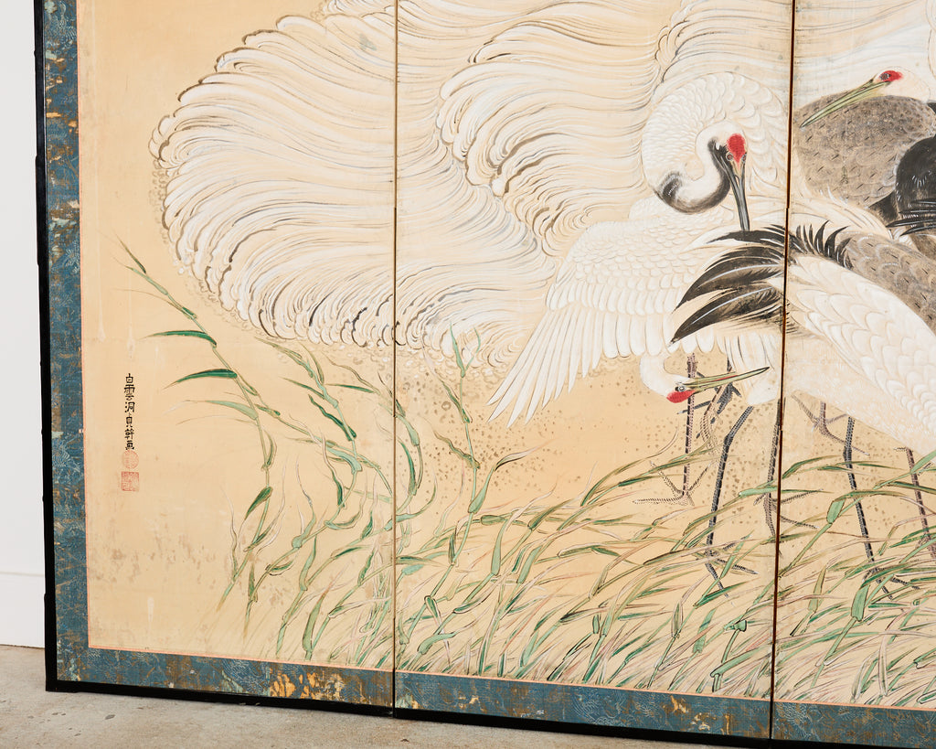 Pair of Japanese Meiji Six Panel Screen Cranes Above Cresting Waves