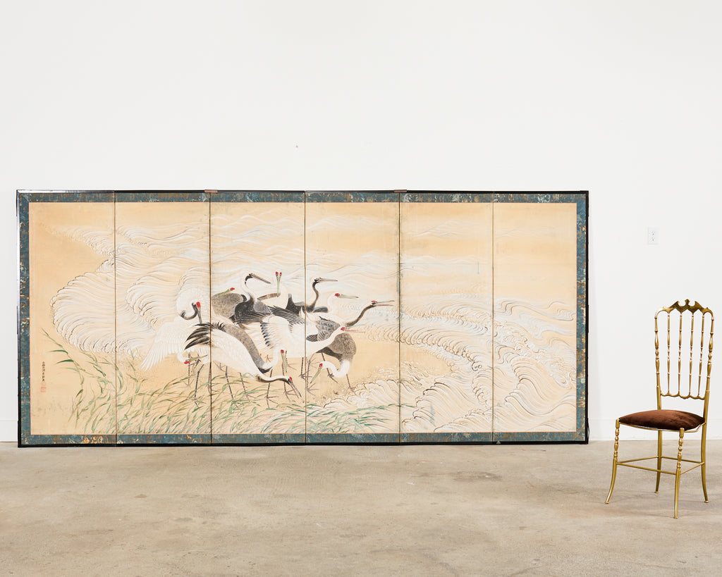 Pair of Japanese Meiji Six Panel Screen Cranes Above Cresting Waves