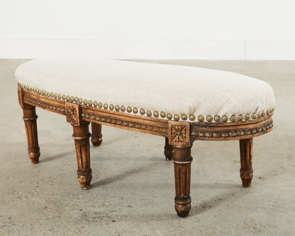 19th Century French Louis XVI Walnut Six Leg Oval Footstool