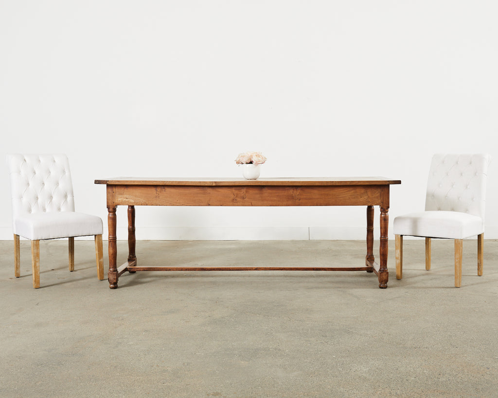 Set of Fourteen Tufted Scroll Back Dining Chairs