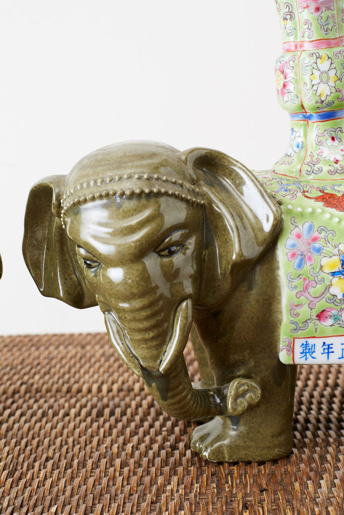 Pair of Chinese Jade Colored Porcelain Elephant Candlesticks