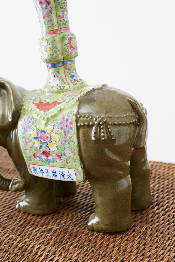 Pair of Chinese Jade Colored Porcelain Elephant Candlesticks