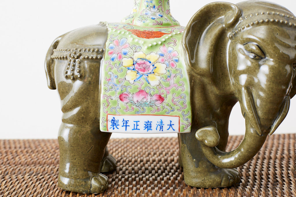 Pair of Chinese Jade Colored Porcelain Elephant Candlesticks