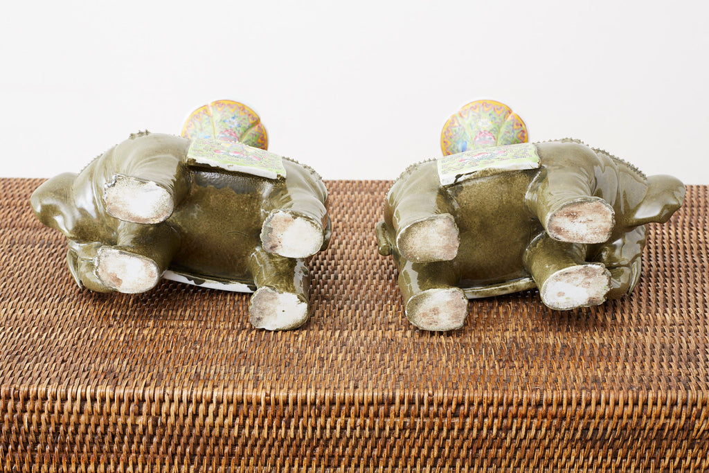Pair of Chinese Jade Colored Porcelain Elephant Candlesticks
