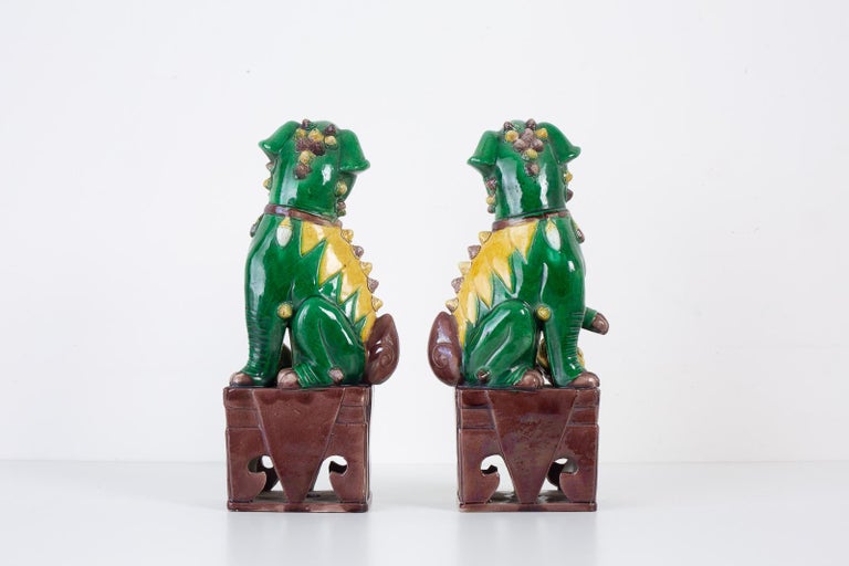 Pair of Chinese Famille Verte Foo Dogs on Stands