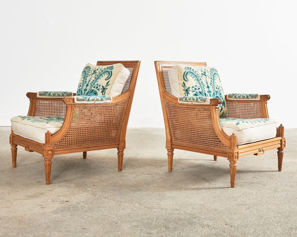Pair of Louis XVI Style Walnut Caned Needlepoint Lounge Chairs