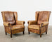 Pair of Distressed Cigar Leather Wingback Chairs with Ottomans