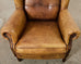 Pair of Distressed Cigar Leather Wingback Chairs with Ottomans