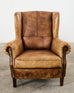 Pair of Distressed Cigar Leather Wingback Chairs with Ottomans