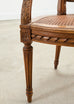 French Louis XVI Style Carved Walnut Cane Fauteuil Armchair