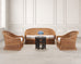 A 3-piece wicker furniture set featuring a curved loveseat, two matching armchairs with white cushions.