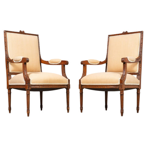 Pair of French Louis XVI Carved Walnut Fauteuil Armchairs
