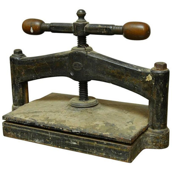 Lot - A cast iron book press, 19th century